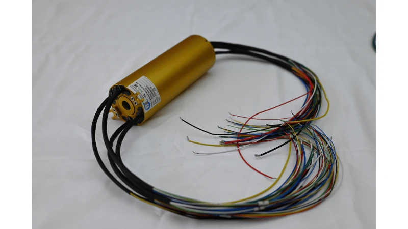 Real ByTune through-hole slip ring with a gold-colored housing and multicolored electrical leads Real ByTune through-hole slip ring with a gold-colored housing and multicolored electrical leads